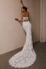 A woman wearing a strapless white lace wedding gown with a long train_XS_