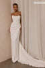 A woman wearing a strapless white wedding gown with a draped bodice and floor-length silhouette_xs_