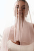 Model wearing a sheer veil