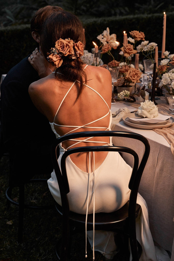 back shot of honey silk wedding dress bride sitting down