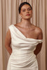 Woman wearing a white off-shoulder dress and pearl earrings