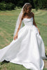 Woman in a white wedding dress with a veil
