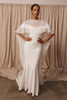 Woman in a wedding dress and sheer bridal cape