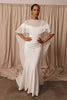 Woman in a wedding dress and sheer bridal cape