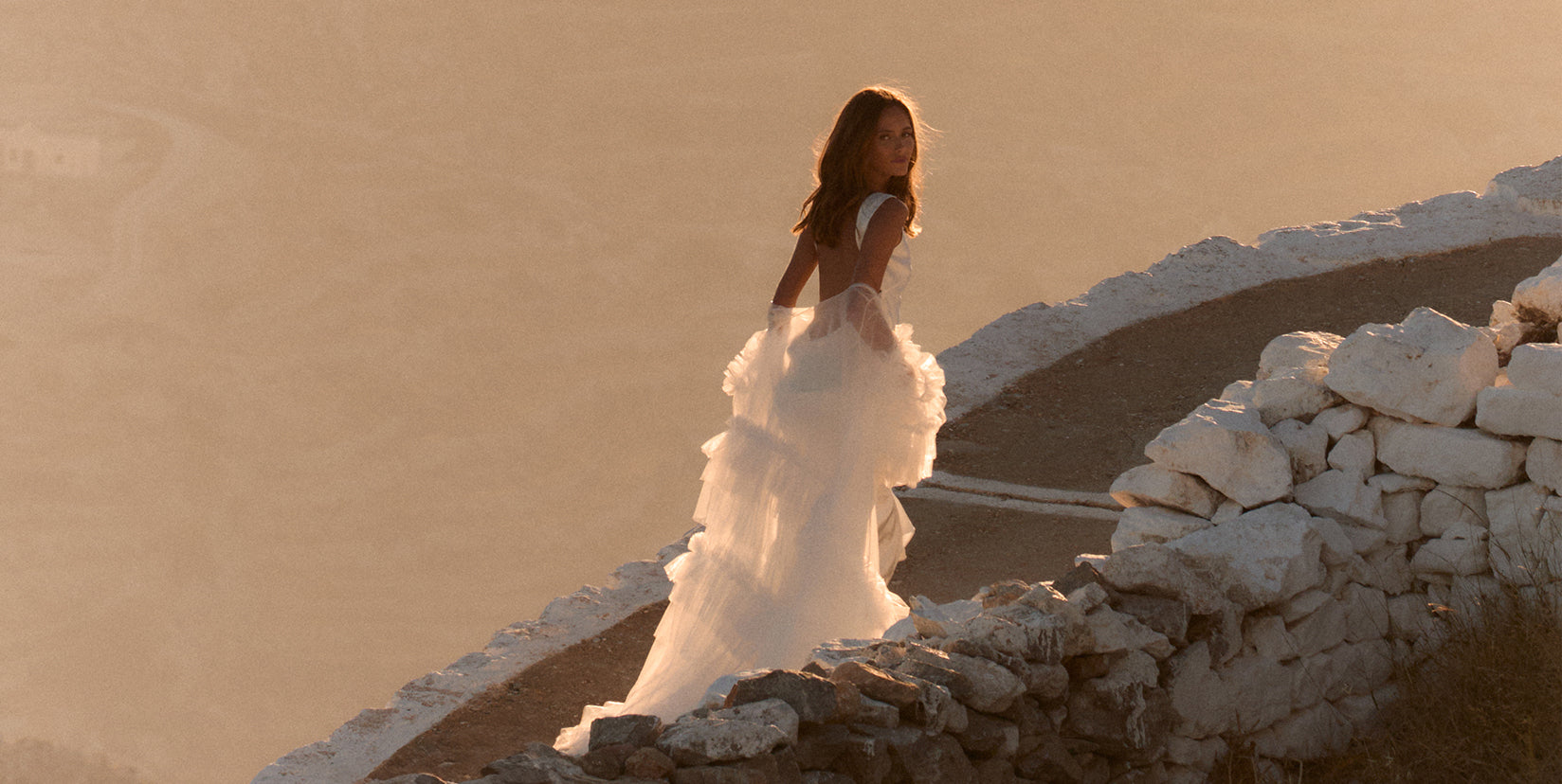 backless wedding dress paired with a bridal robe