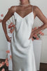 A woman in a satin wedding dress.
